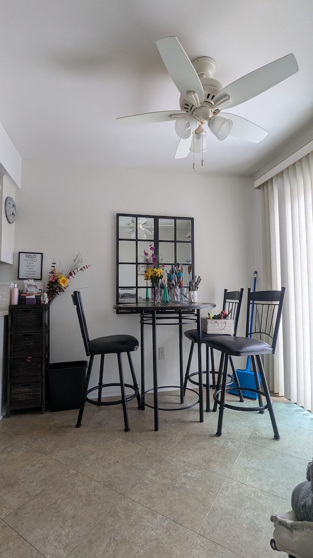 dining room featuring ceiling fan
