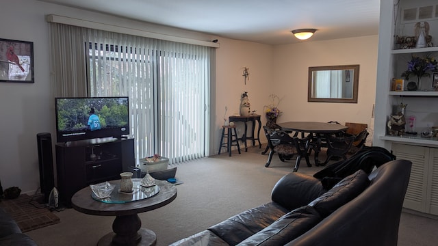 carpeted living room with visible vents