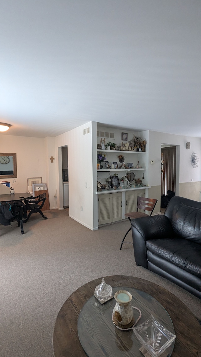 carpeted living room featuring visible vents
