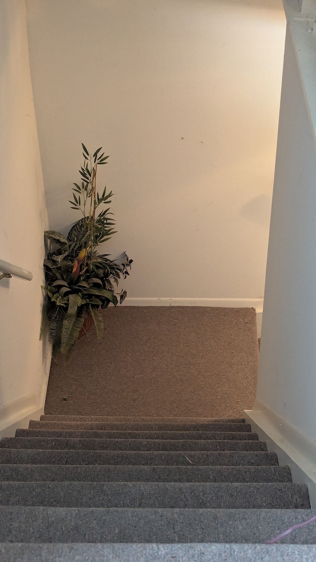 stairs featuring baseboards
