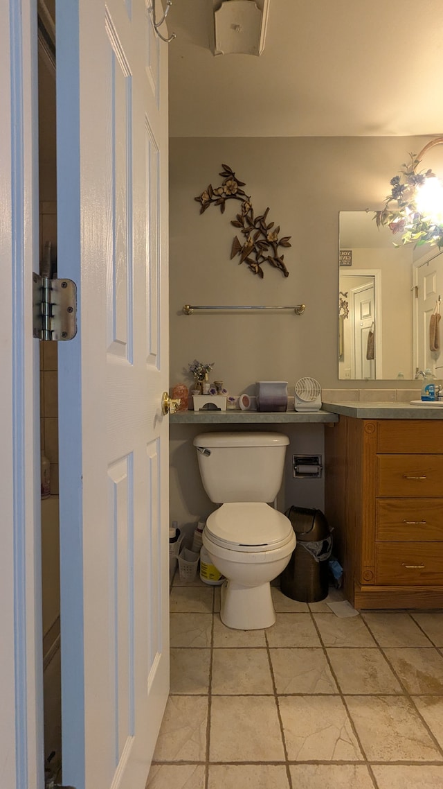 bathroom featuring toilet and vanity
