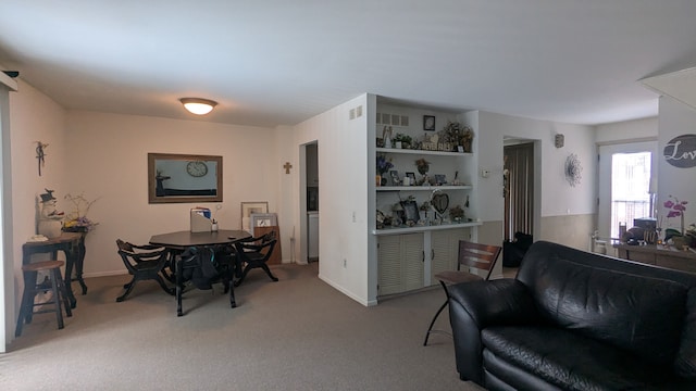 interior space with carpet flooring and visible vents