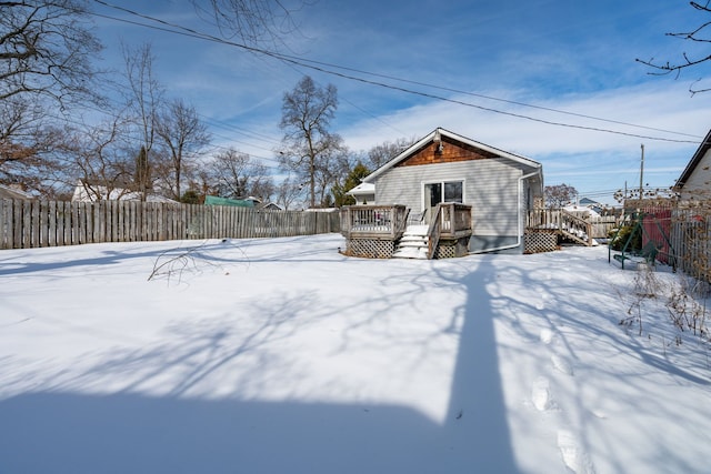 exterior space with a deck and fence