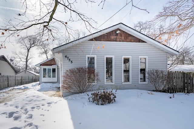 view of front of house with fence