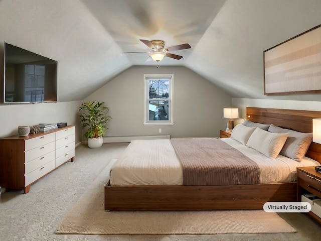 bedroom featuring light carpet, a baseboard heating unit, vaulted ceiling, and a ceiling fan