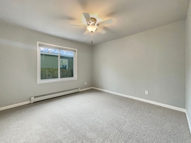 carpeted empty room featuring a baseboard radiator, baseboards, and a ceiling fan