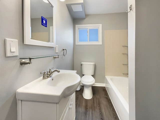 full bath with toilet, vanity, shower / tub combination, wood finished floors, and baseboards