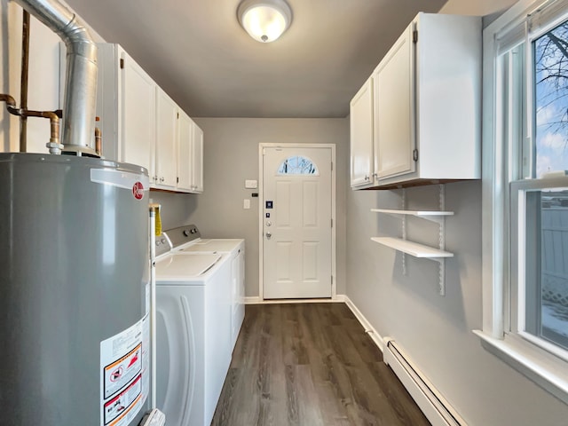 laundry room featuring cabinet space, a baseboard radiator, dark wood-type flooring, washing machine and dryer, and gas water heater