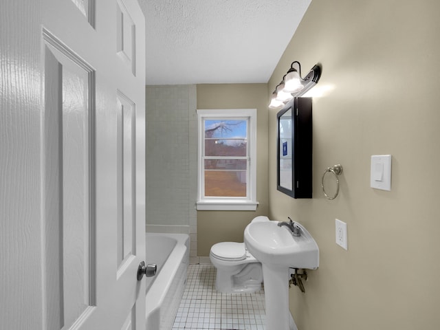 full bath featuring a tub to relax in, a shower, toilet, a textured ceiling, and tile patterned floors