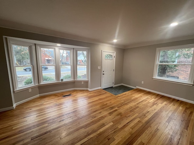 entrance foyer featuring recessed lighting, baseboards, visible vents, and hardwood / wood-style floors