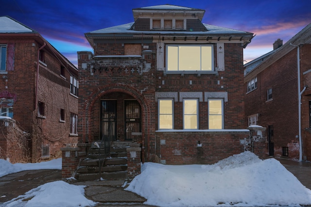 view of front of home featuring brick siding