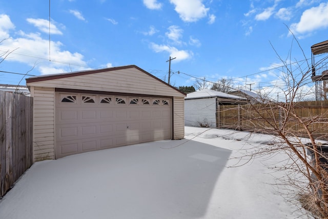 detached garage with fence