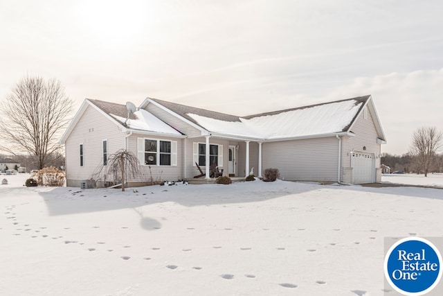 ranch-style home with a garage and covered porch