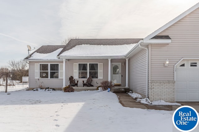 view of front of home with a porch and brick siding