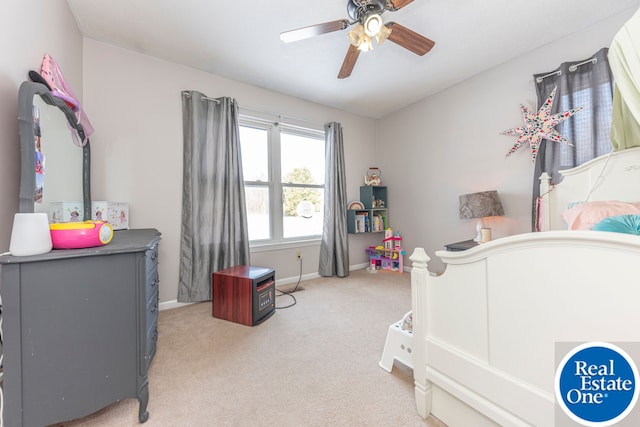 bedroom with light carpet, a ceiling fan, and baseboards