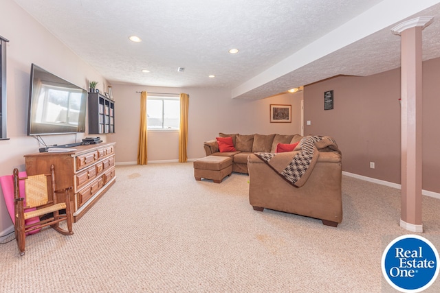 living area with a textured ceiling, baseboards, and light colored carpet