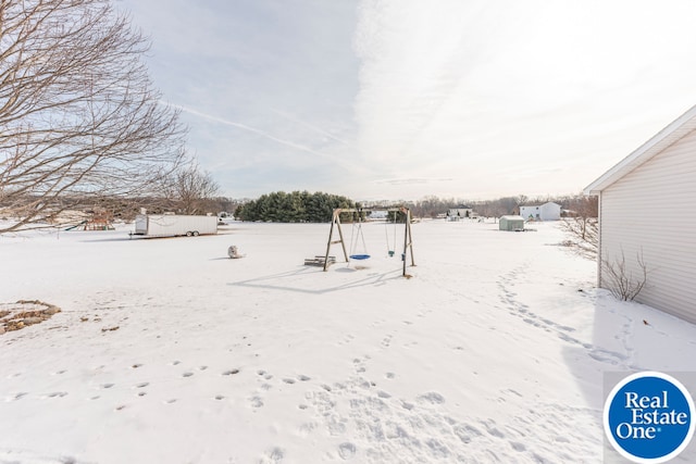 view of yard layered in snow