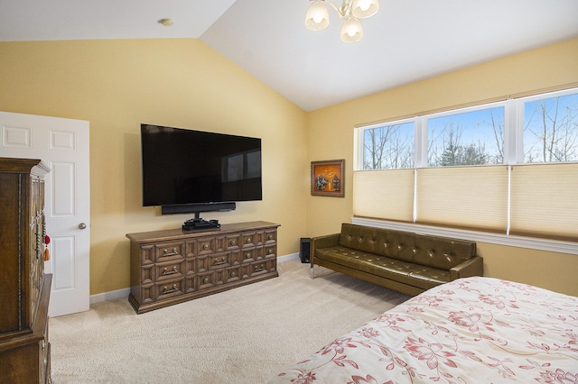 bedroom featuring lofted ceiling, multiple windows, and light colored carpet