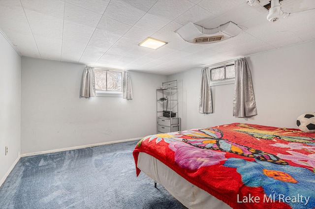 bedroom with carpet flooring and baseboards