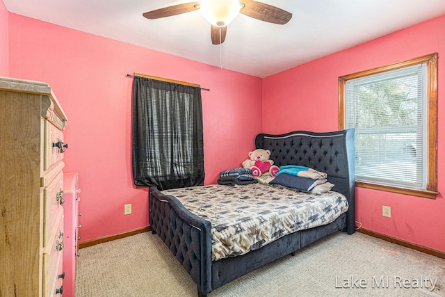 bedroom featuring carpet, baseboards, and a ceiling fan