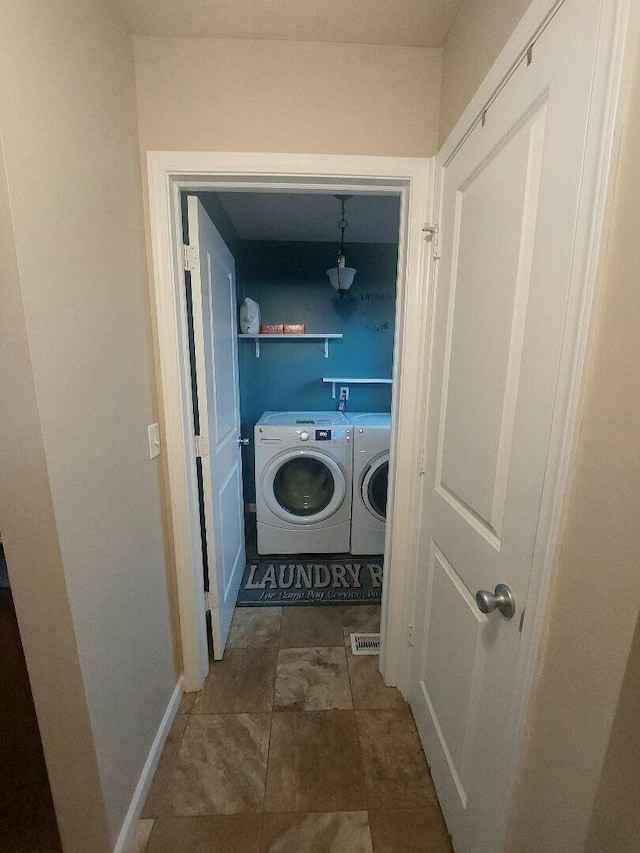 laundry room with baseboards, laundry area, visible vents, and washer and dryer