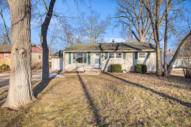 single story home featuring a front lawn and a chimney