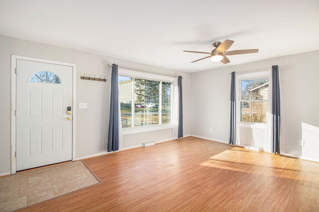 entrance foyer featuring ceiling fan, baseboards, and wood finished floors