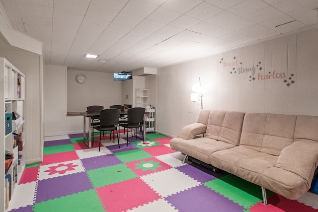 recreation room featuring baseboards and tile patterned floors