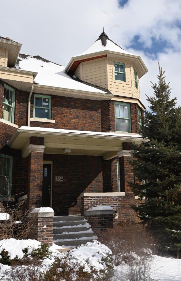 view of front of property with covered porch and brick siding