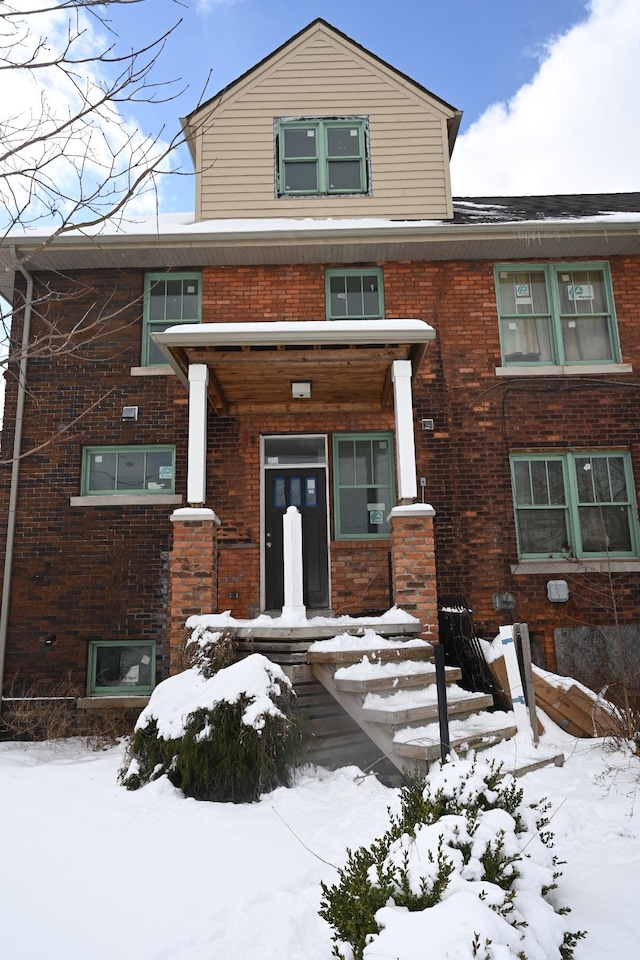 view of front of home with brick siding