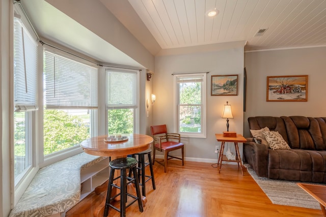 interior space featuring wooden ceiling, visible vents, crown molding, and baseboards