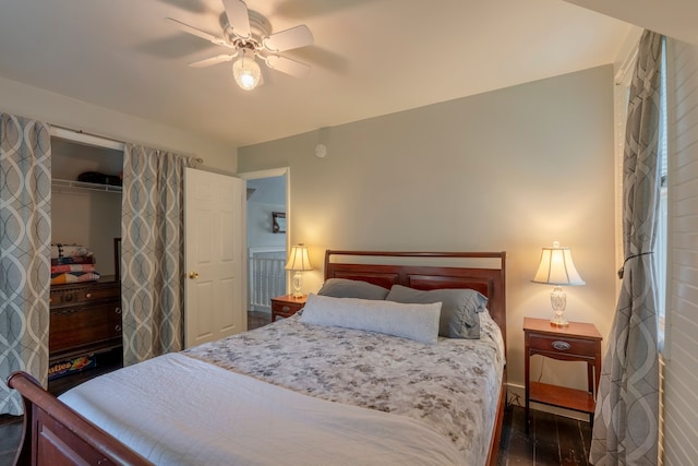 bedroom featuring dark wood finished floors, a closet, and ceiling fan