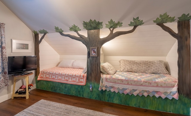 bedroom featuring lofted ceiling and dark wood-style flooring