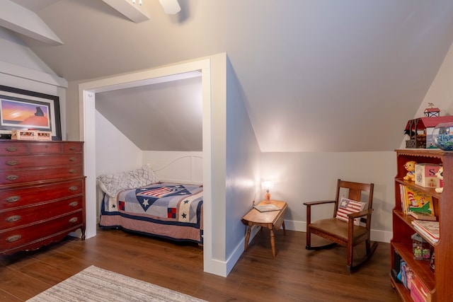 bedroom featuring baseboards, vaulted ceiling, and dark wood-type flooring