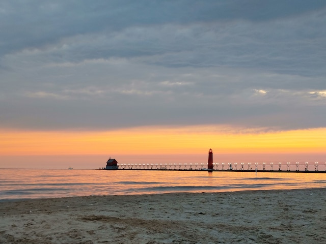 property view of water featuring a beach view