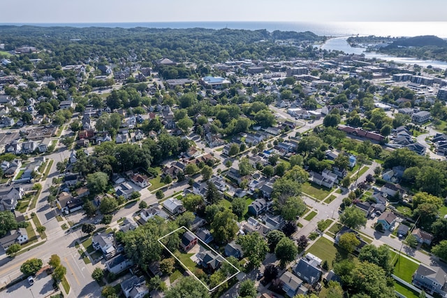 birds eye view of property featuring a water view and a residential view