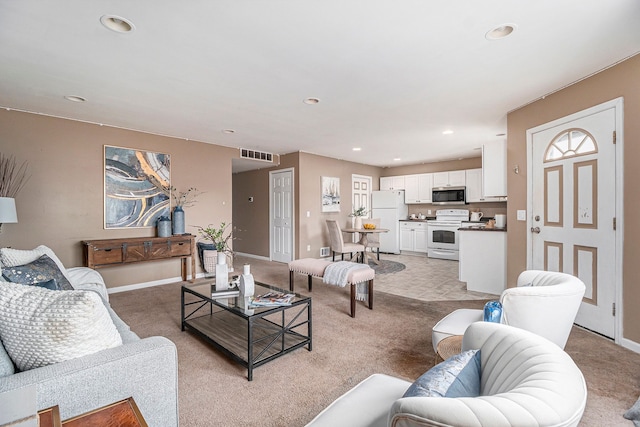 living room featuring light carpet, baseboards, visible vents, and recessed lighting