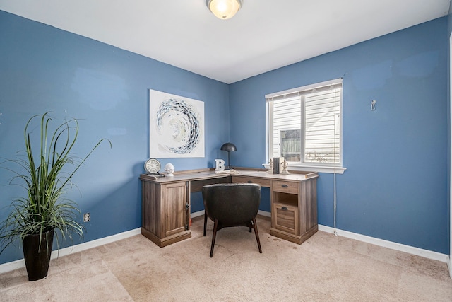 office space with light carpet and baseboards