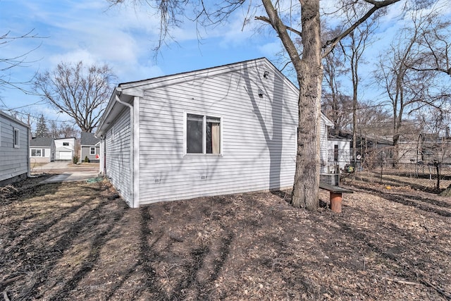 view of home's exterior featuring fence