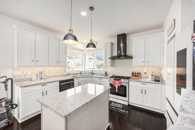 kitchen featuring a sink, black dishwasher, wall chimney range hood, decorative backsplash, and gas range