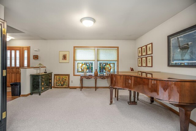 home office with baseboards, carpet floors, and a healthy amount of sunlight