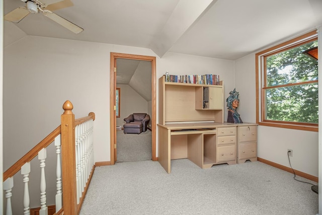 office with vaulted ceiling, baseboards, a ceiling fan, and light colored carpet