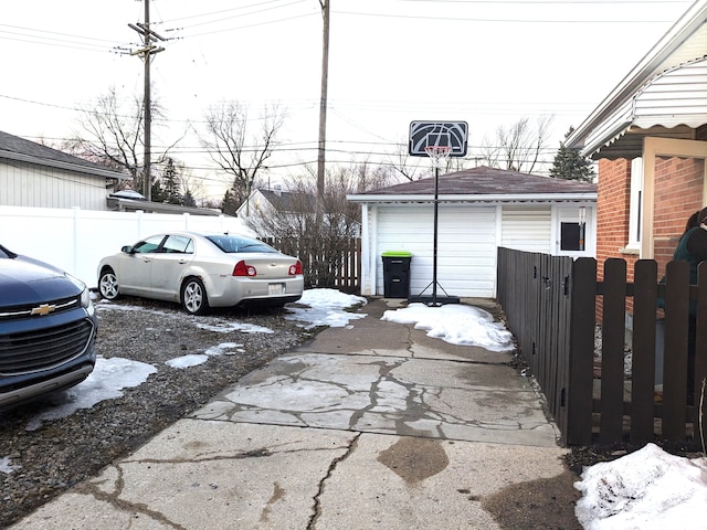 view of car parking featuring fence