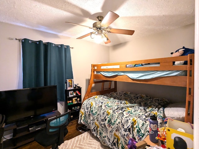 bedroom featuring a ceiling fan and a textured ceiling