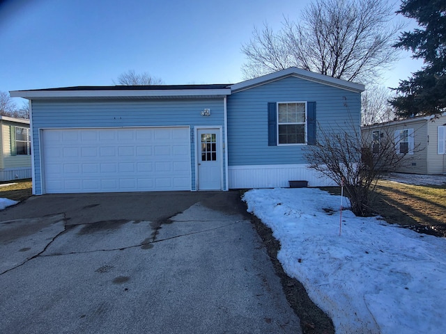 view of front of property with a garage and concrete driveway