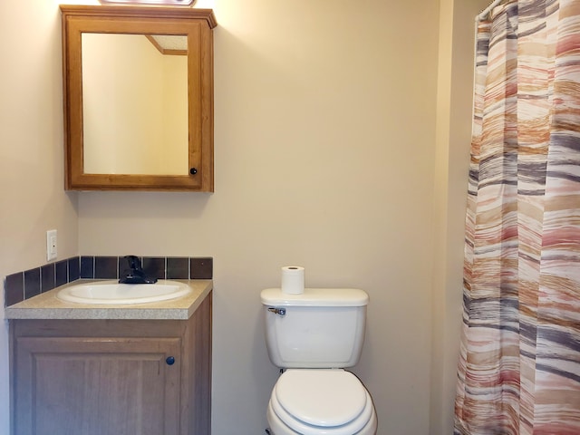 full bath with vanity and toilet