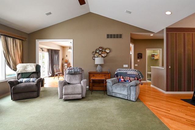 living room with lofted ceiling, recessed lighting, visible vents, ceiling fan, and wood finished floors