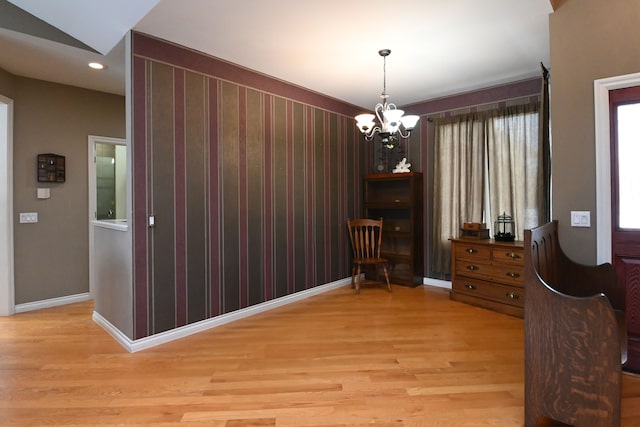 sitting room with a chandelier, recessed lighting, baseboards, and light wood-style floors