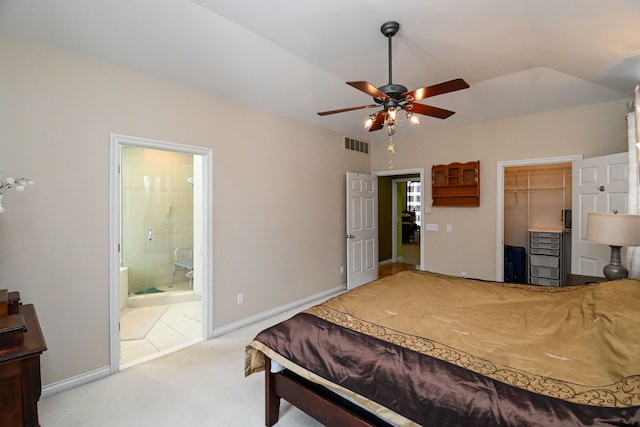 bedroom with lofted ceiling, visible vents, baseboards, a closet, and carpet