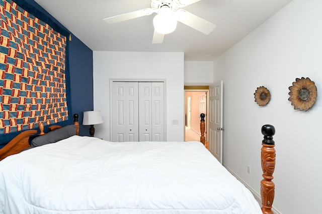 bedroom with a ceiling fan and a closet